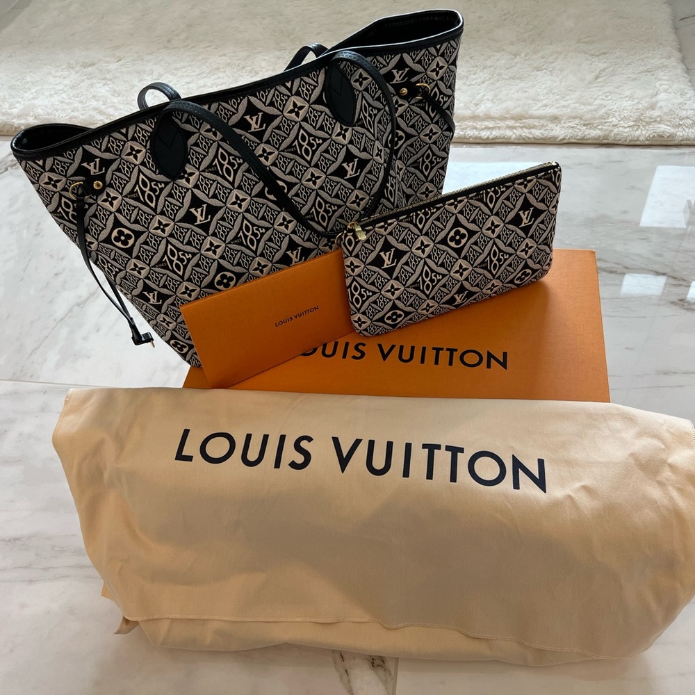 Authentic Louis Vuitton, since 1854 Neverfull MM with pouch.